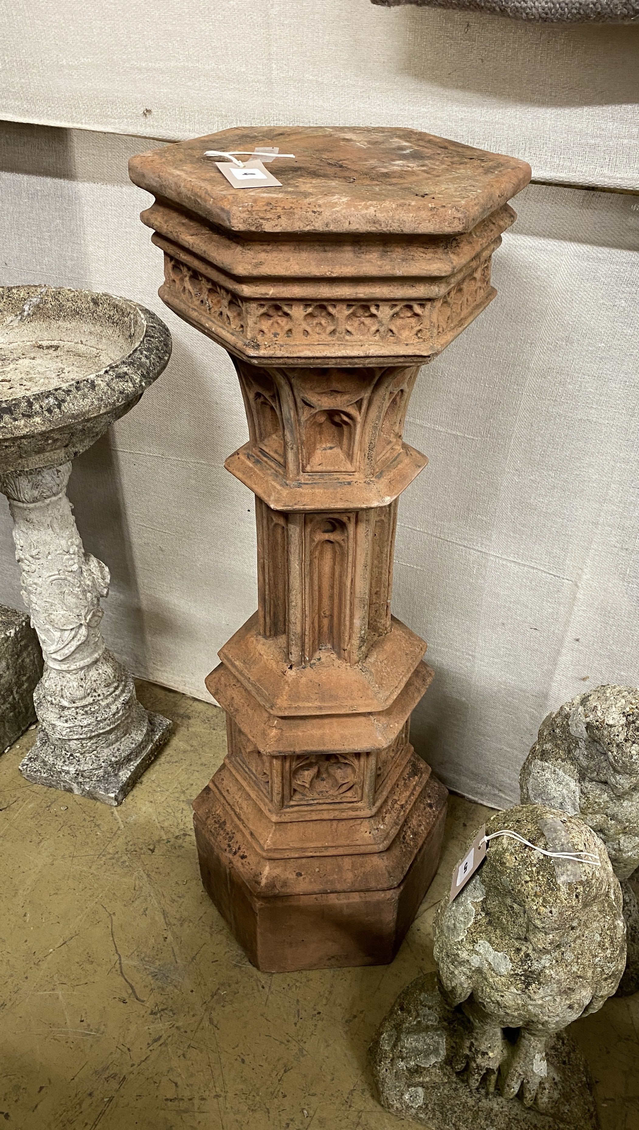 A Gothic style hexagonal terracotta garden column, width 29cm, height 92cm